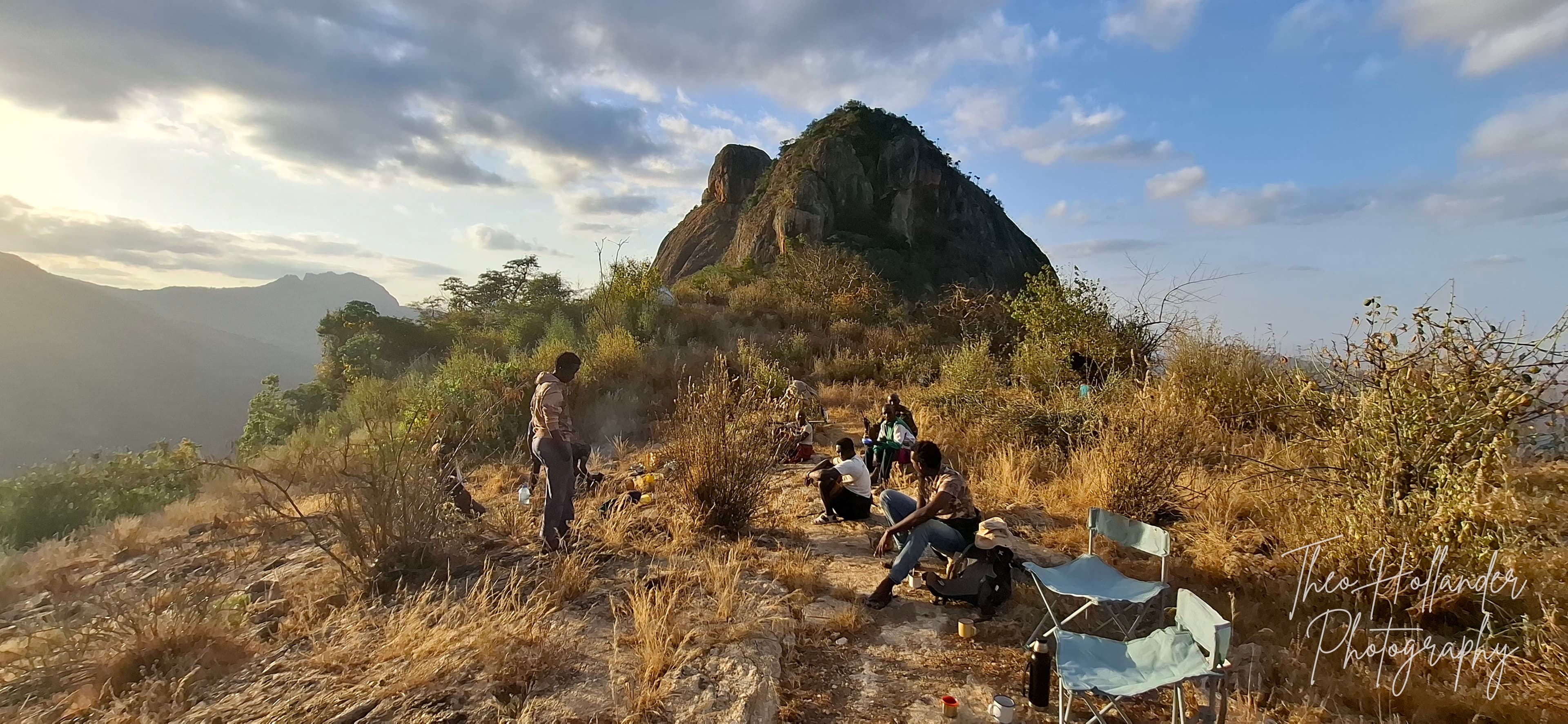 A wild camp pitched on a misty mountain summit