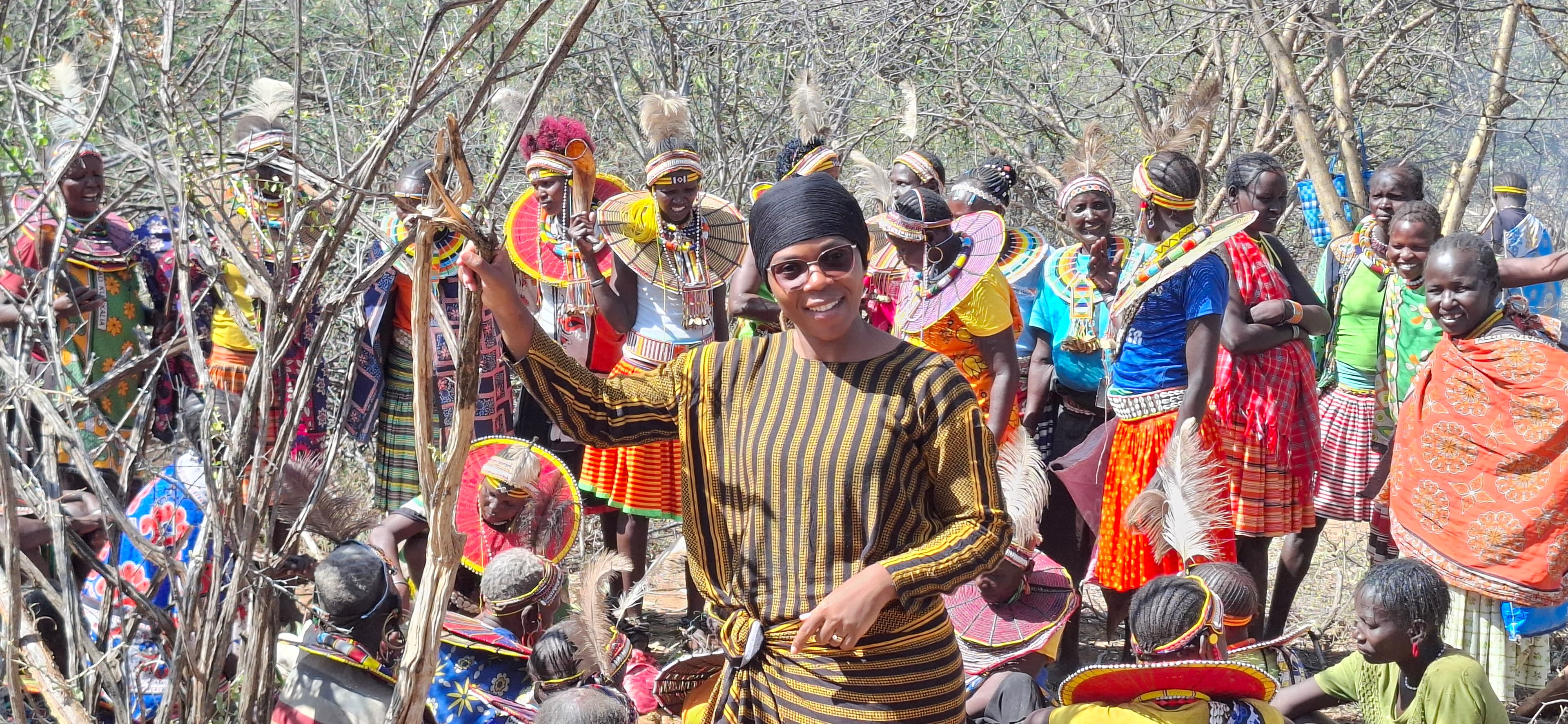 Immersion in the sacred traditions of the Pokot, surrounded by women in traditional feathered headdresses
